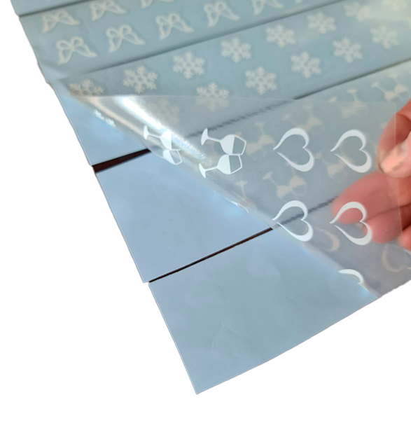 Use the application tape to lift stickers away from the backing tape