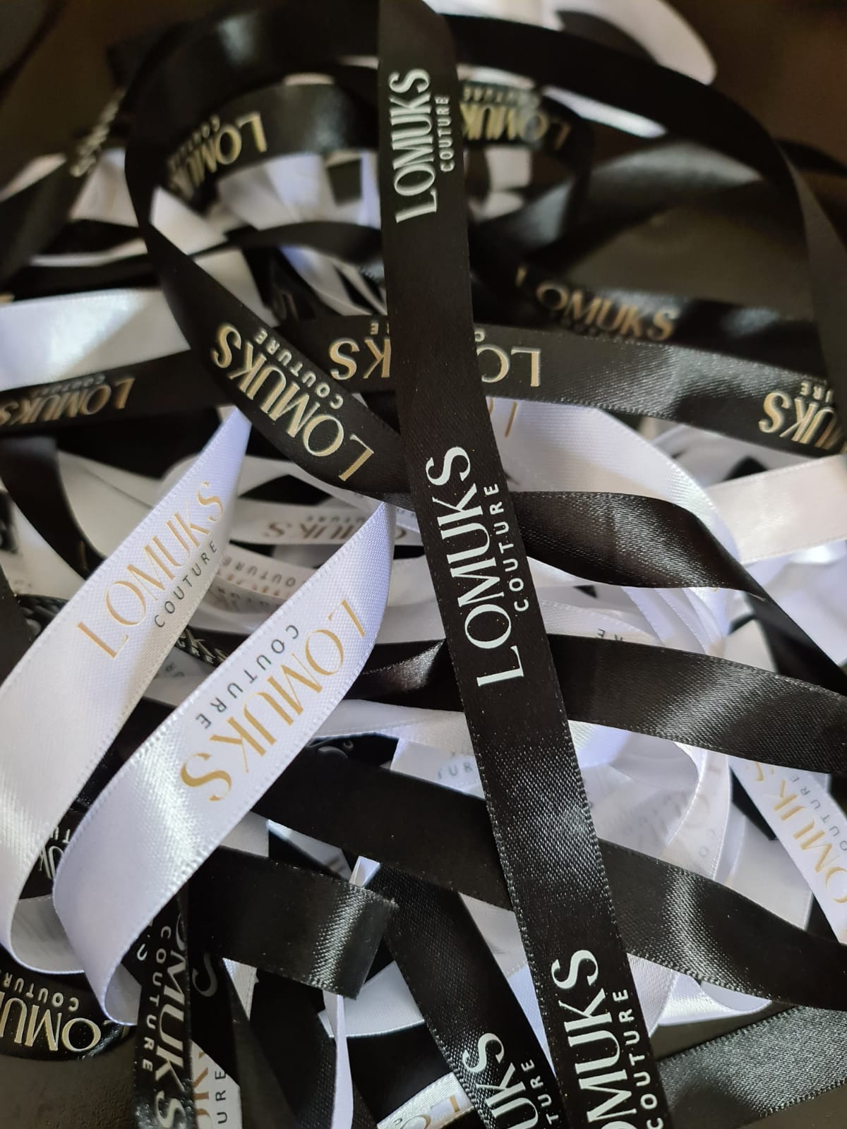 Black and white ribbon branded