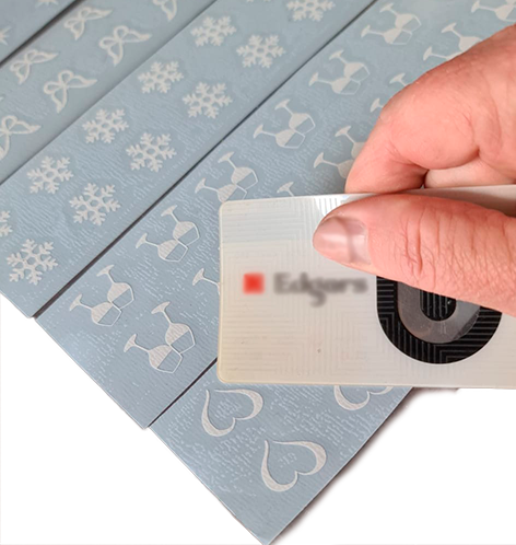 Rub down the application tape onto the stickers in order to lift up the stickers from the backing tape