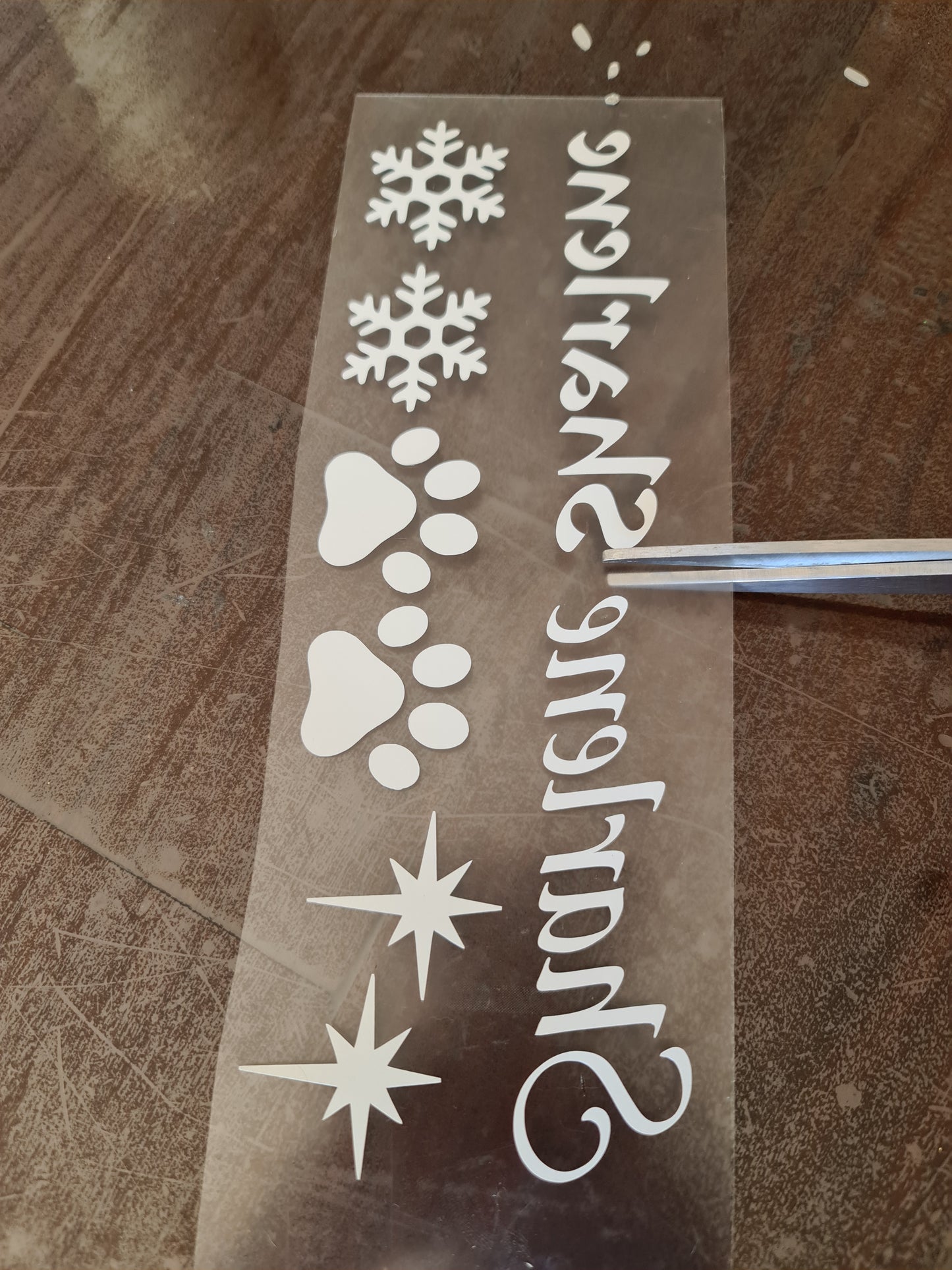 Do it yourself DIY heat vinyl decals for Christmas hats, stockings, or any fabric.