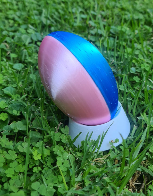 Gender reveal rugby ball. Pink and blue outside.  