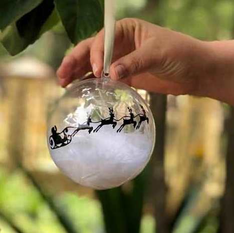 Clear gift bauble with sleigh